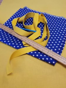 fournitures sac polochon coton uni jaune et bleu étoilé
